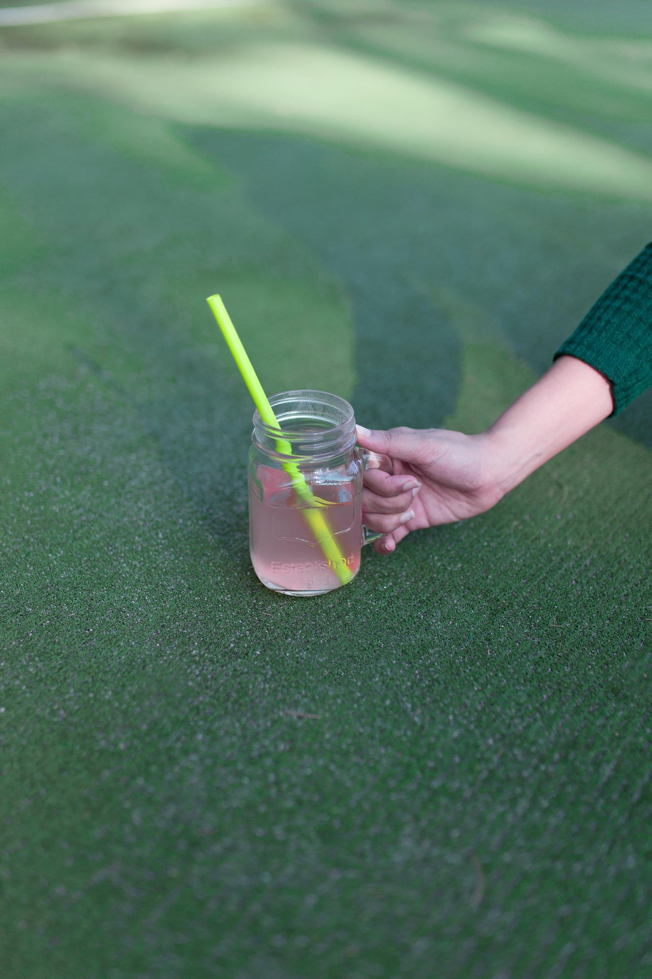 Removing debris from artificial turf surface